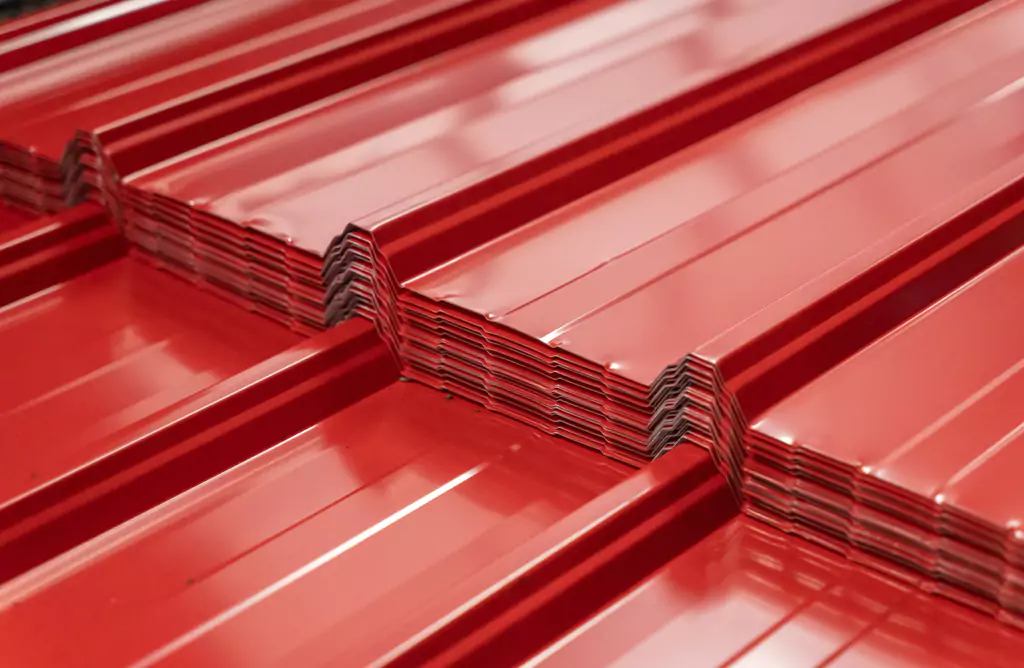 Red Metal Roofing Sheets Stacked Together